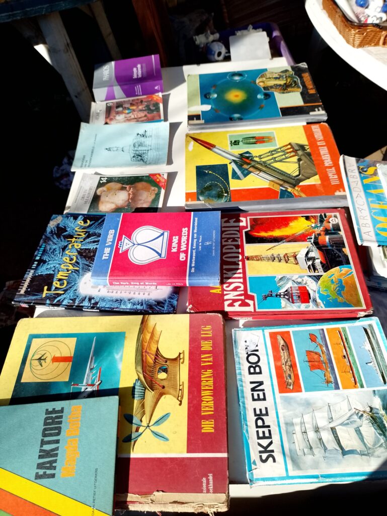 Mixed lot of 12 assorted books — encyclopaedia, non‑fiction & paperbacks (well‑worn, damaged)