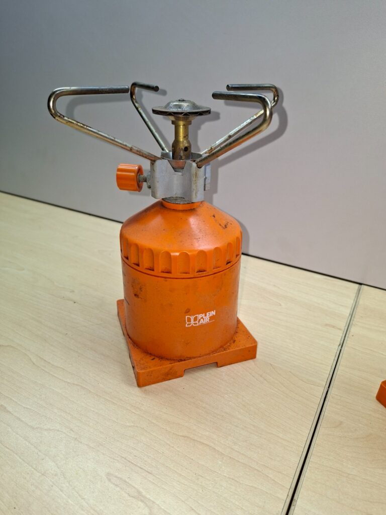Pair of orange Plein Air / CADAC screw-on portable camping gas stoves — used, needs gas & clean