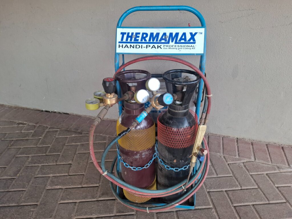 Thermamax Handi-Pak portable oxy-acetylene welding & cutting kit on trolley — 2 small cylinders, regulators, hoses, torch + accessory case