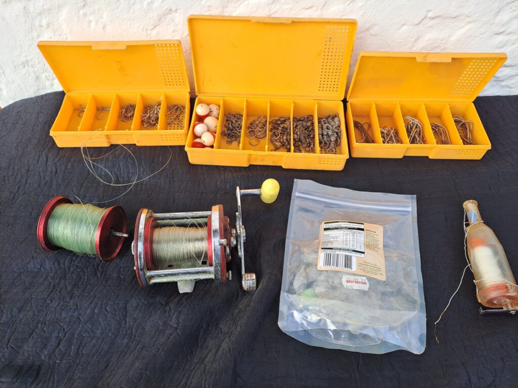 Mixed Fishing Tackle Lot — 3 Compartment Boxes, Assorted Hooks, Swivels, Weights, Floats + 2 Reels (one stamped ‘Penn Master 1650’)