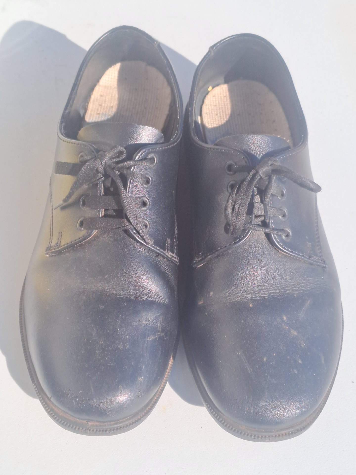 Toughees black school shoes — child size 5, preowned pair with scuffs