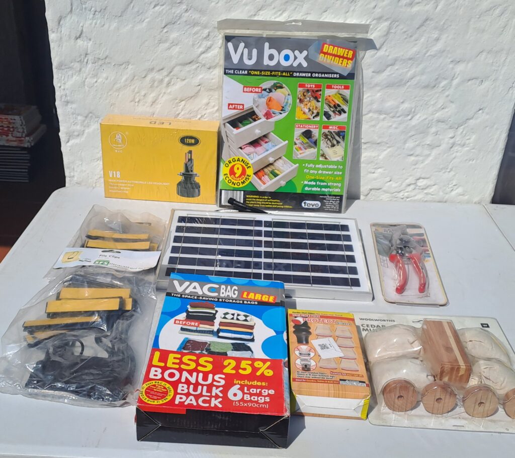 Assorted household & DIY lot — small solar panel, EJC V18 LED headlight (boxed), VacBag, Vu box drawer organisers, pruners, cedar blocks & more (packaged/untested)