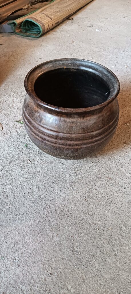 Glazed round stoneware pot / planter — ribbed brown finish, intact rim