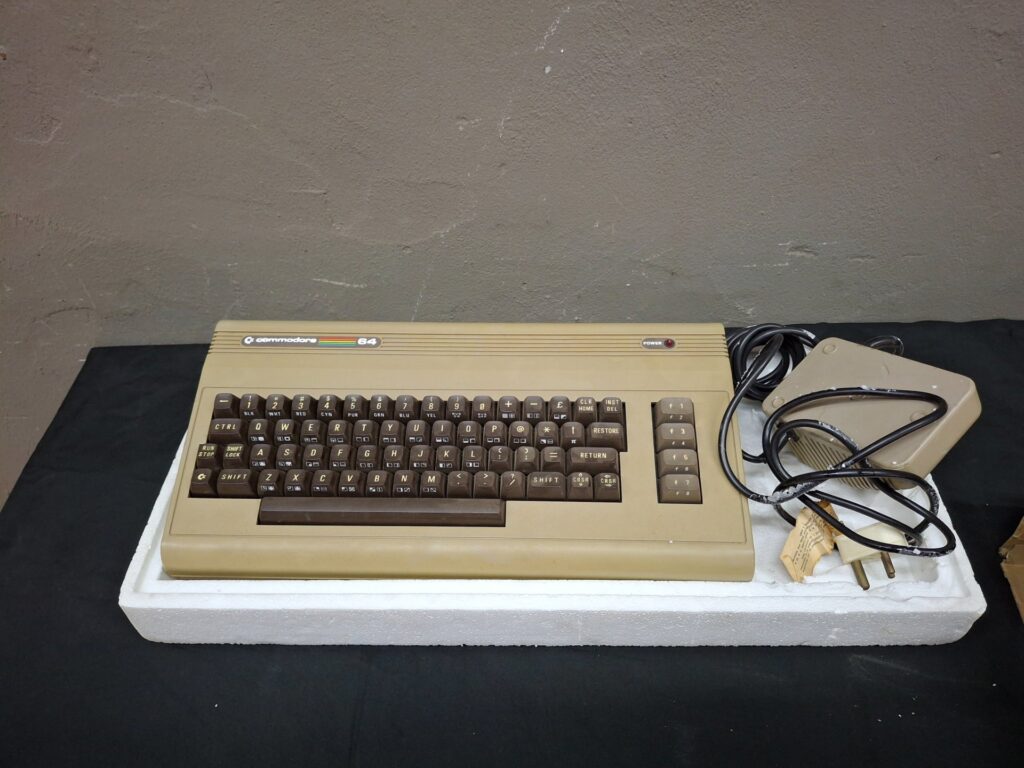 Commodore 64 (breadbin) in original box with styrofoam and power lead — cosmetic vintage unit
