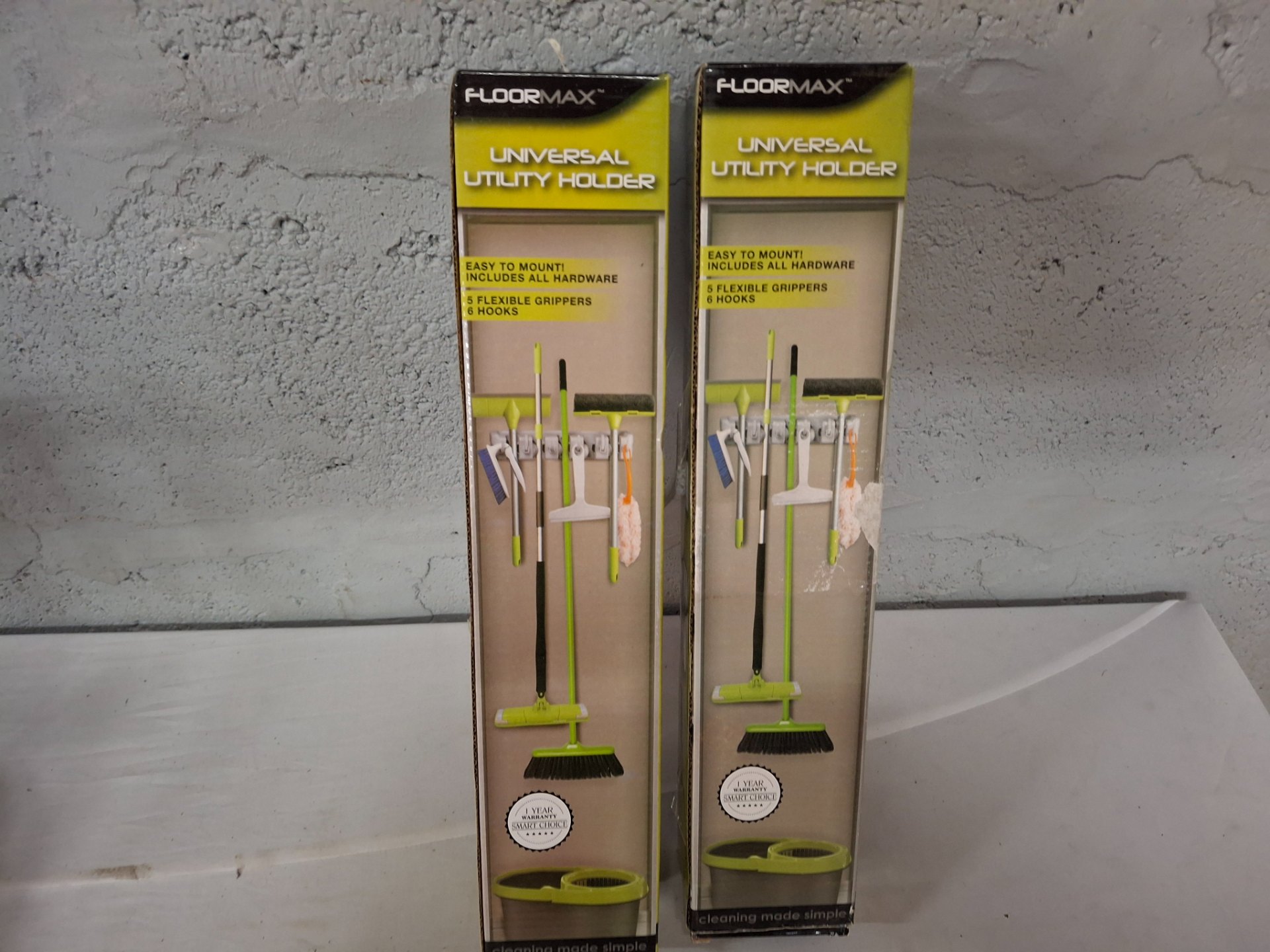 FLOORMAX Universal Utility Holder — 2 boxed sets + 1 loose multi-grip wall holder (boxes opened, hardware present)