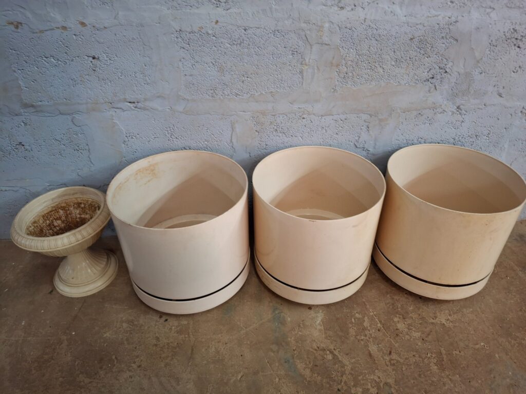 Lot of 4 Plastic Planters — 3 Large Round Self-Watering Style + 1 Decorative Urn (Used, Stained)