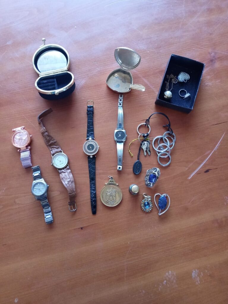 Mixed lot: Assorted wristwatches, pendants, rings, keyrings & small trinket box — visible wear, untested