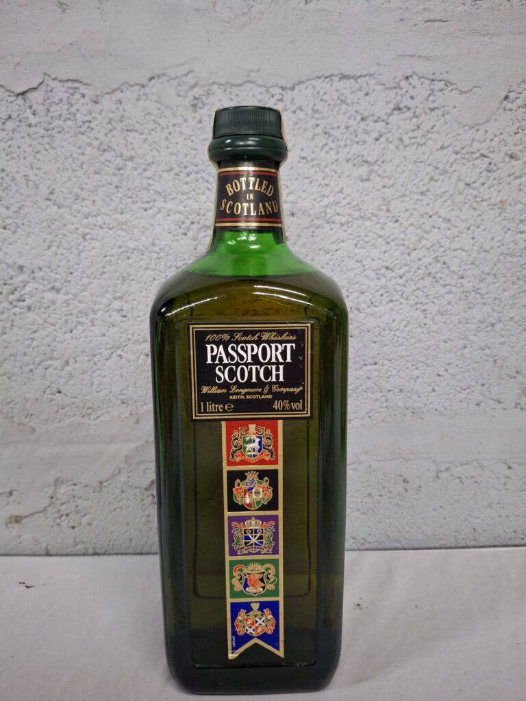 Passport Scotch 1 Litre (40% vol) — sealed bottle, label wear
