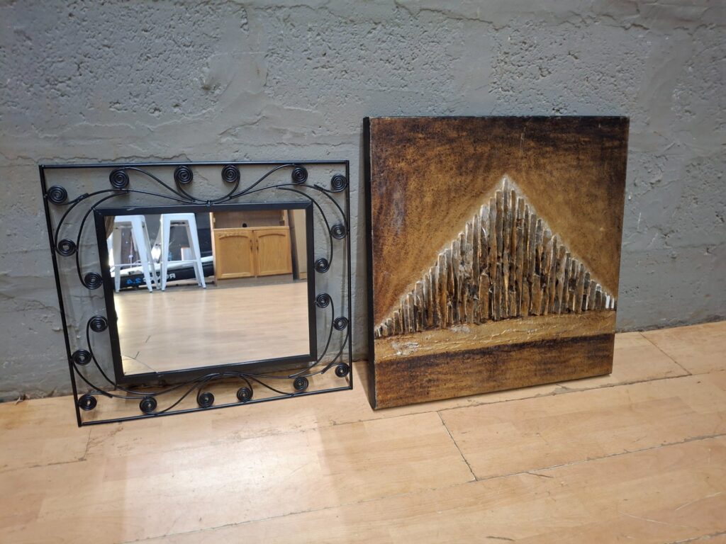 Lot: Decorative metal-framed mirror + textured wall art panel — sold together