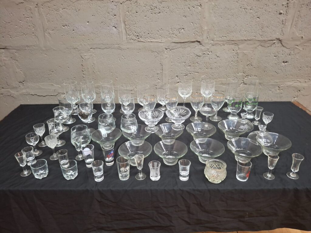 Lot of 64 Mixed Glassware — wine, tumblers, shots, footed bowls (some gold rim & printed logo)