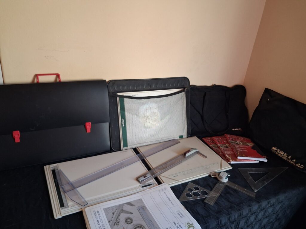 Mixed drafting kit — 2 drawing boards with sliding rulers, rulers, set squares, templates, Waltons carry bag & 3 Mind Action workbooks