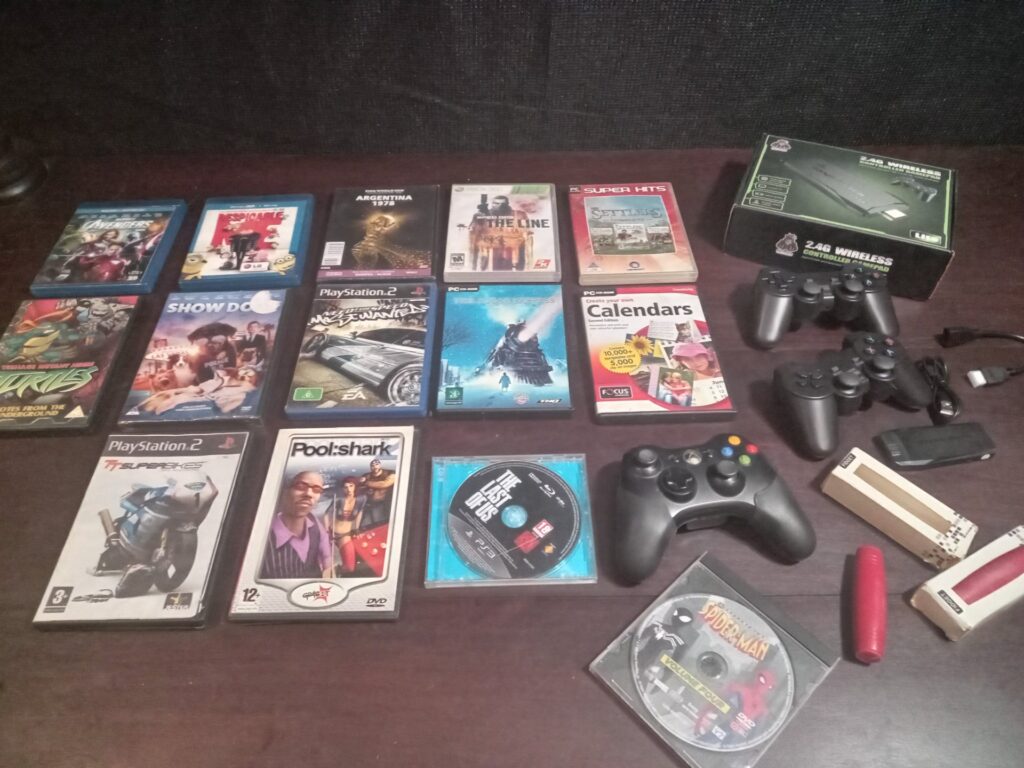 Mixed lot: Game media (PS2/PS3/PC/DVD/Xbox) + multiple controllers & boxed GameStick Lite HDMI dongle — used, untested