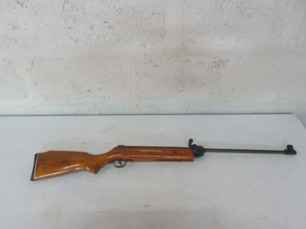 Air rifle (wooden stock) — adjustable rear sight, rubber butt pad, used, working