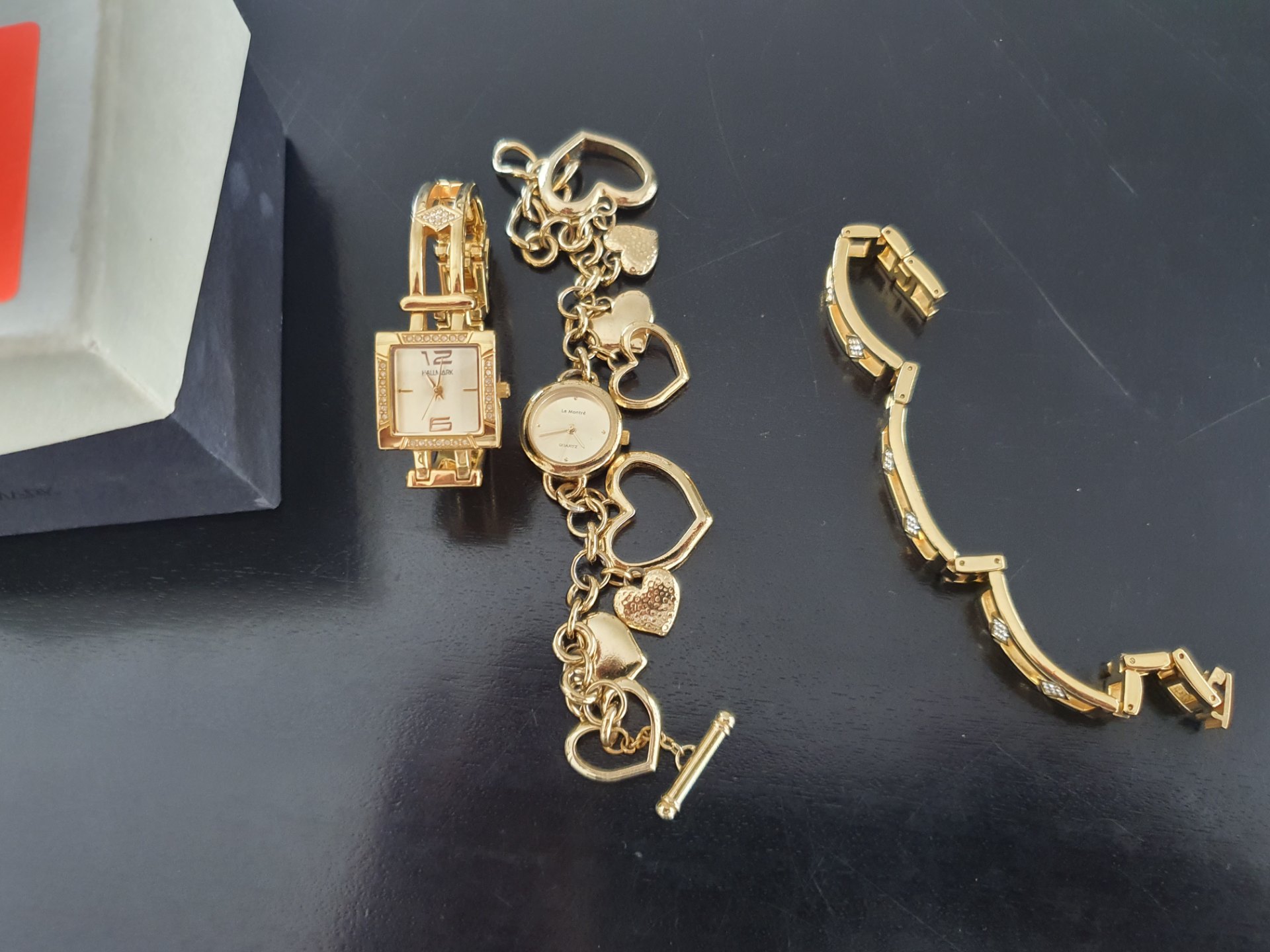 Mixed lot: Ladies’ gold‑tone bracelet watches – HALLMARK square + La Montré charm watch (plated, not working)