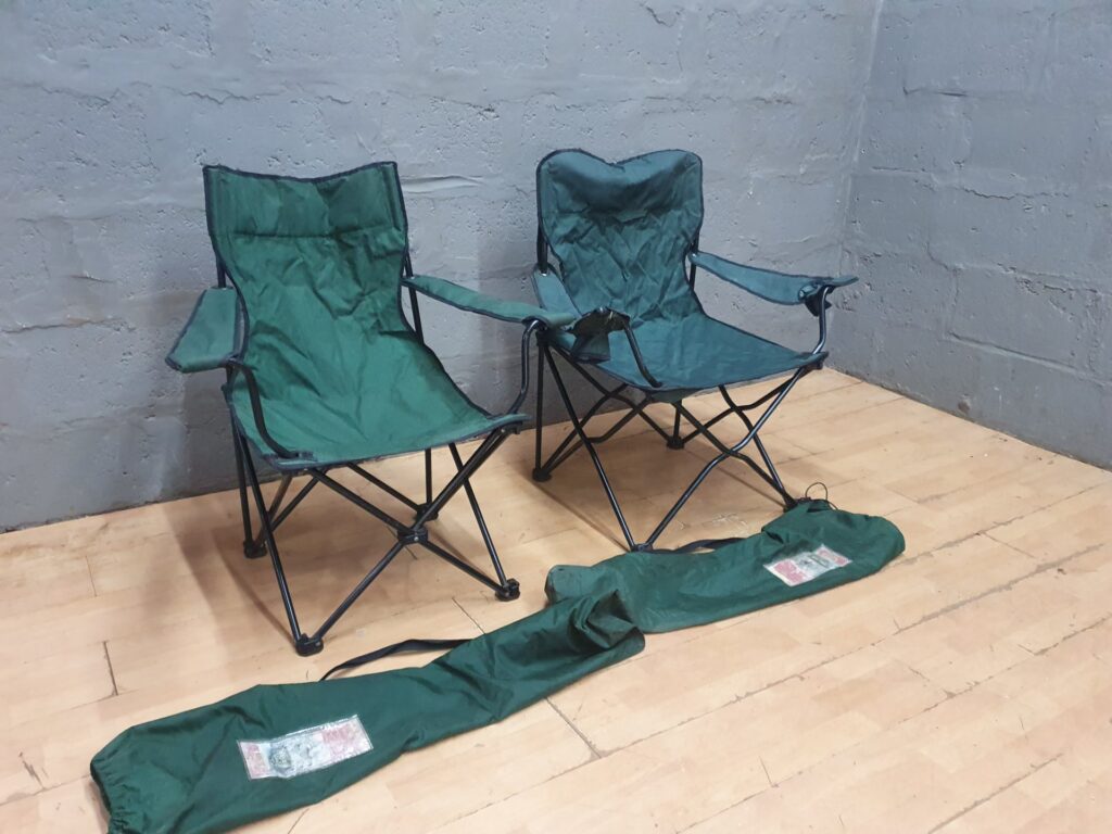 Pair of Green Folding Camping Chairs with Carry Bags – Used, One Arm Tear
