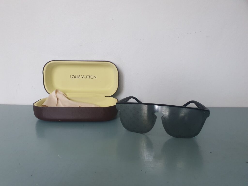 Louis Vuitton‑marked Shield Sunglasses with Branded Hard Case & Cloth — Lenses with Light Surface Marks