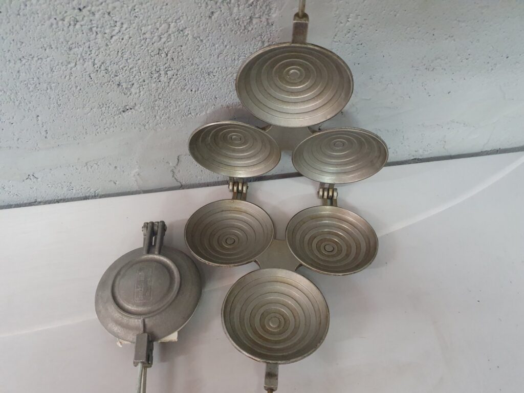 Pair of Cast Stovetop Hinged Moulds (3-cup sets) with Two Handles — used, surface corrosion/staining