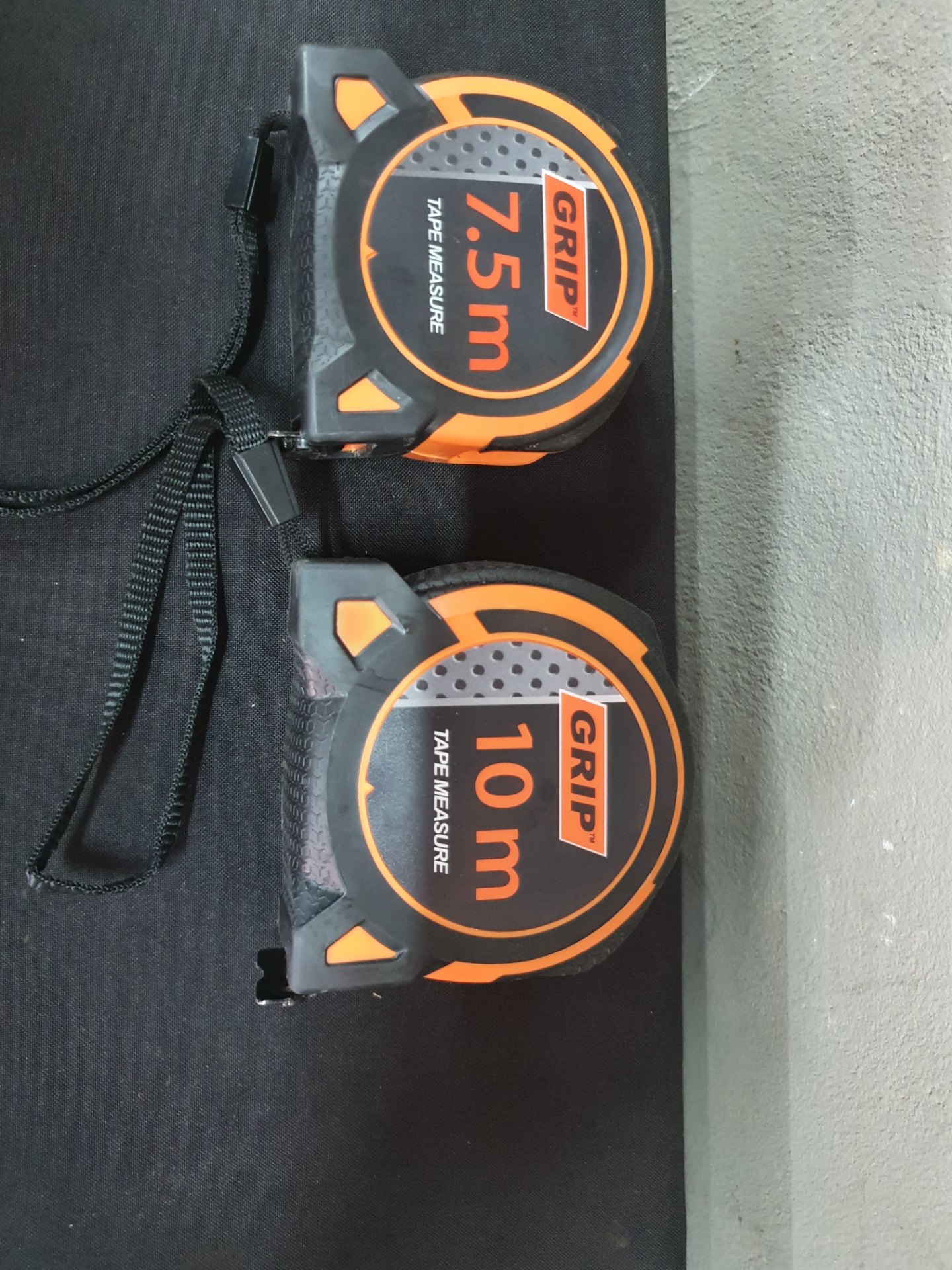 Pair of GRIP tape measures 7.5m + 10m — tested, working, belt clips