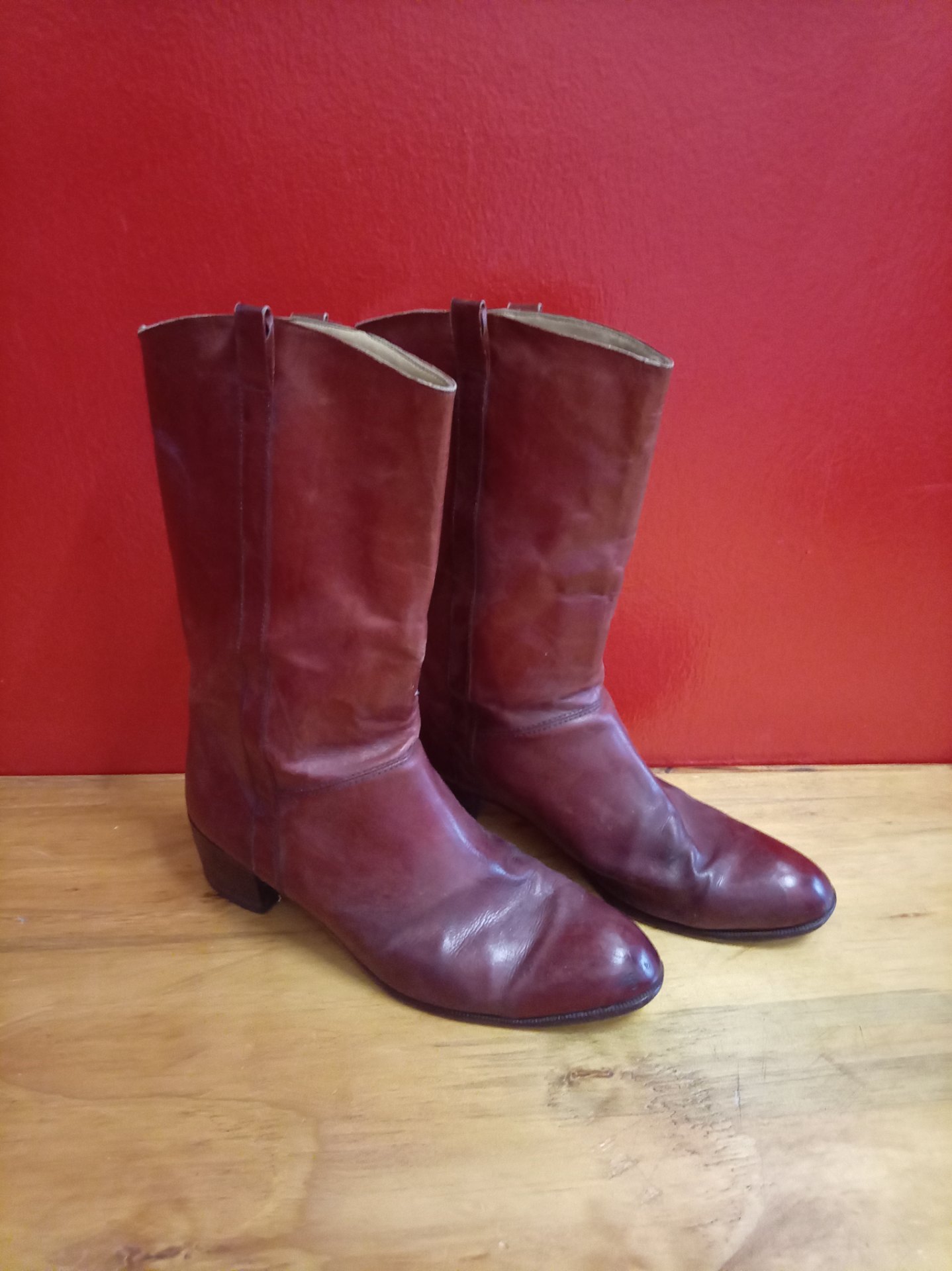 Burgundy mid-calf leather boots (labelled UK10) — worn soles, scuffs & creasing