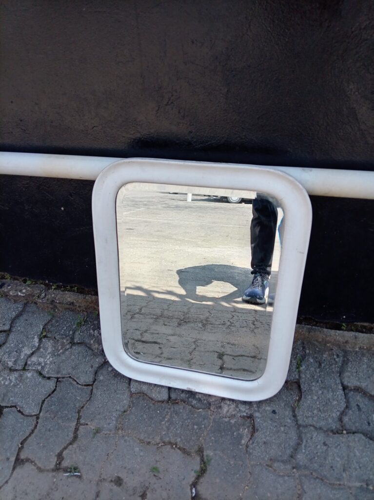 White Plastic-Framed Wall Mirror (rounded corners) — Scuffed Frame, Glass Intact
