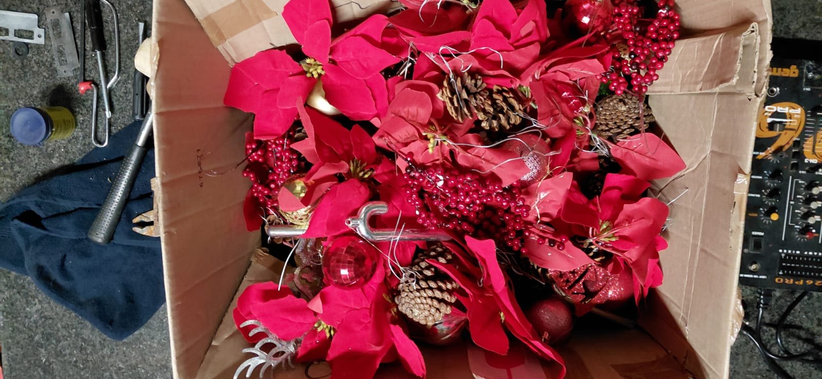 Lot 09: Box of Mixed Red Christmas Decorations — Poinsettias, Baubles, Pinecones & Silver Toppers