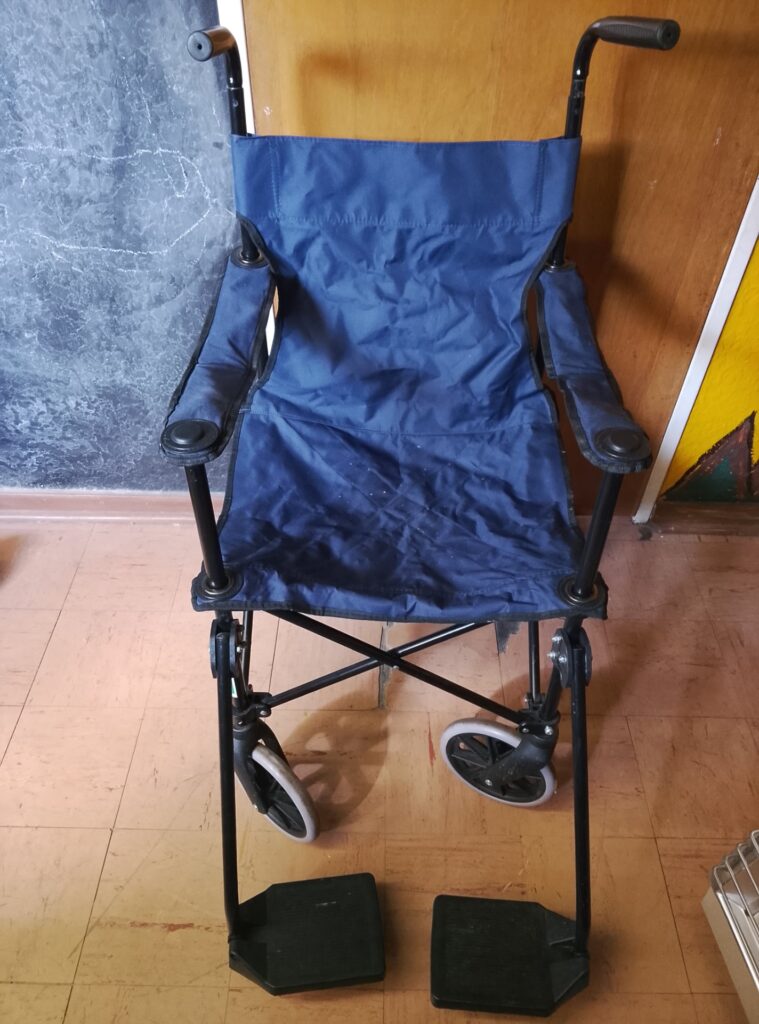 Folding blue transit / transport wheelchair with carry bag — used, seller says working