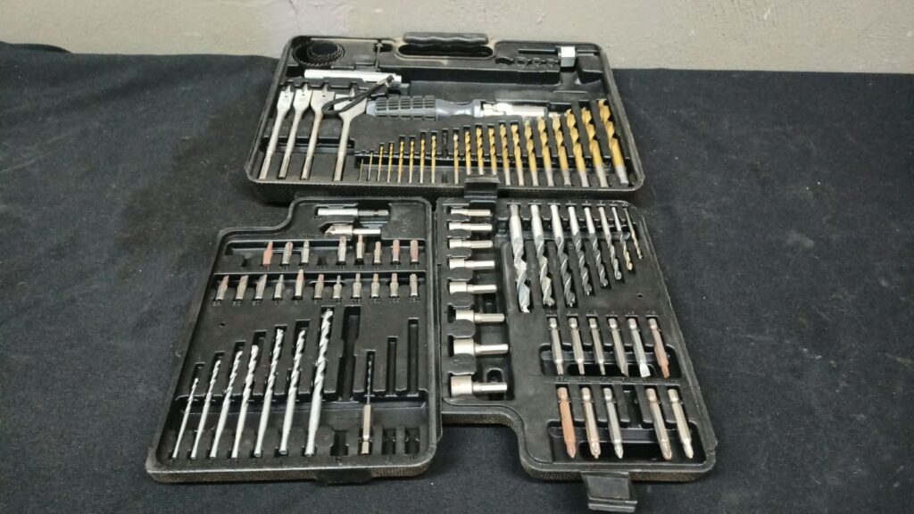 63-piece Assorted Drill, Driver & Spade Bit Set in Plastic Case — Used, Surface Rust, Case Damaged