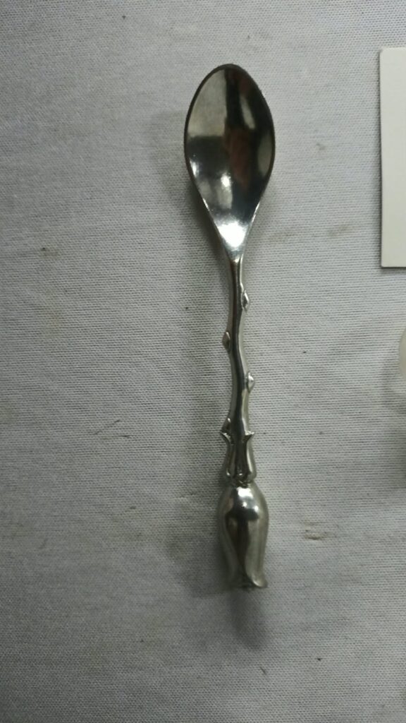 Jenna Clifford decorative tulip‑handle spoon — silver‑plate (JC mark) with organza bag & care card