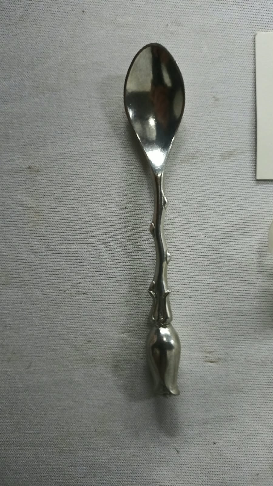 Jenna Clifford decorative tulip‑handle spoon — silver‑plate (JC mark) with organza bag & care card
