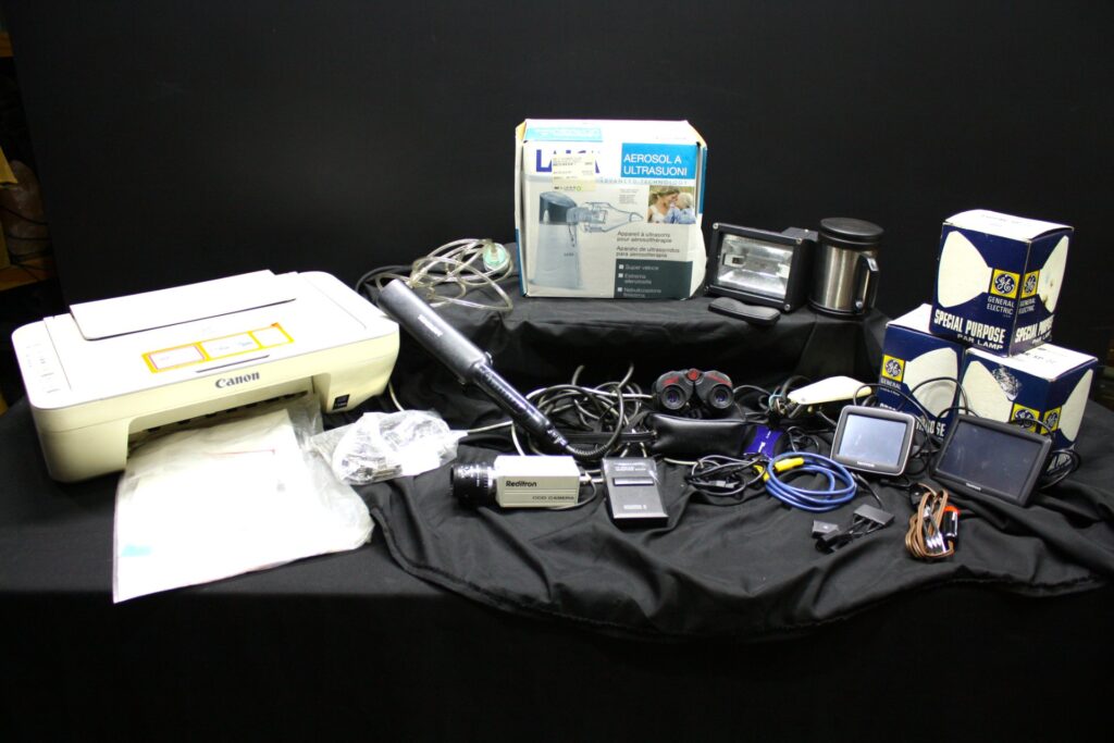 Mixed lot: Canon printer, TomTom GPS (x2), Laica nebuliser (boxed), Reditron CCD camera, Toni&Guy styler, cables & accessories – Untested
