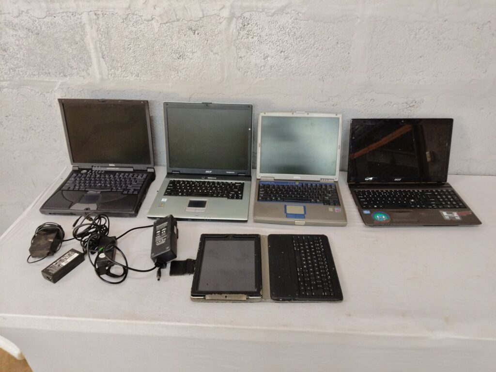 Lot: 5 used laptops + tablet (Dell, Acer visible) — spares & repairs, heavy wear
