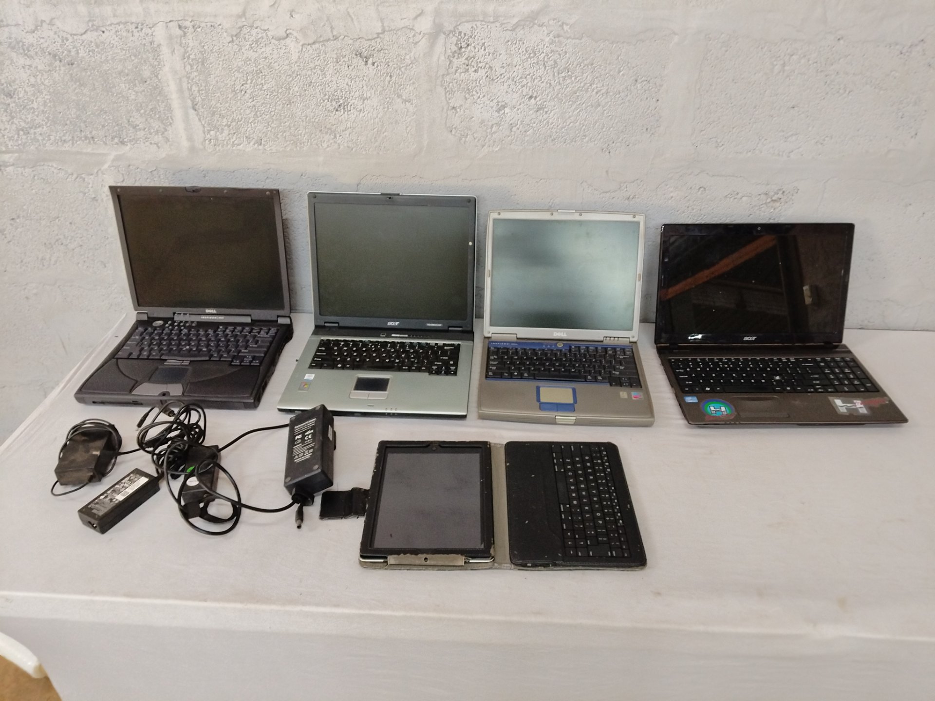 Lot: 5 used laptops + tablet (Dell, Acer visible) — spares & repairs, heavy wear