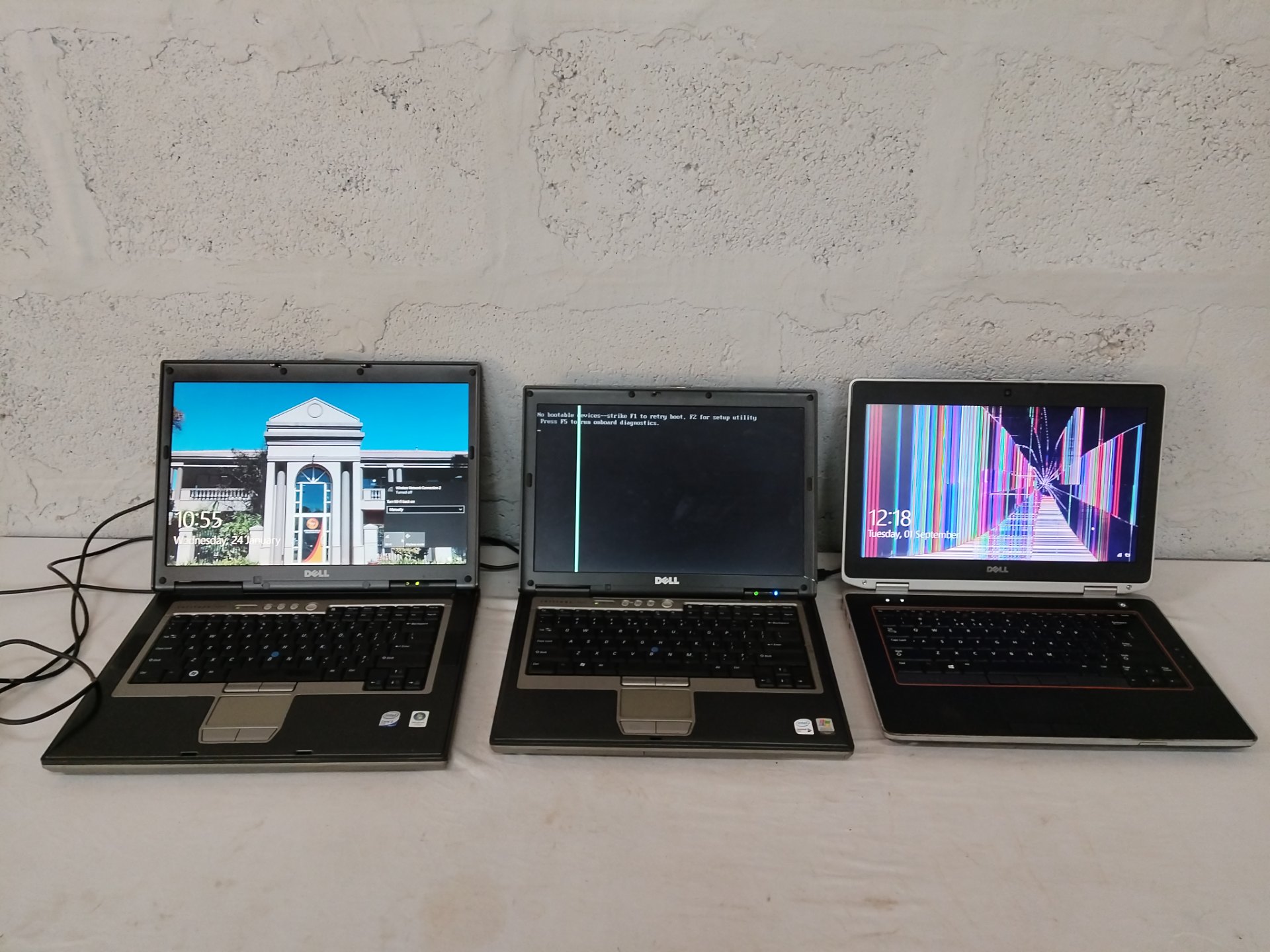 Lot of 3 Dell laptops – mixed working condition, chargers included, two with screen/boot faults