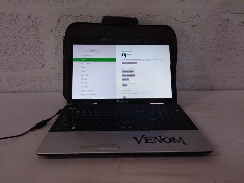 Packard Bell laptop — boots to Windows 8, charger & carry bag (used, stickers & wear)