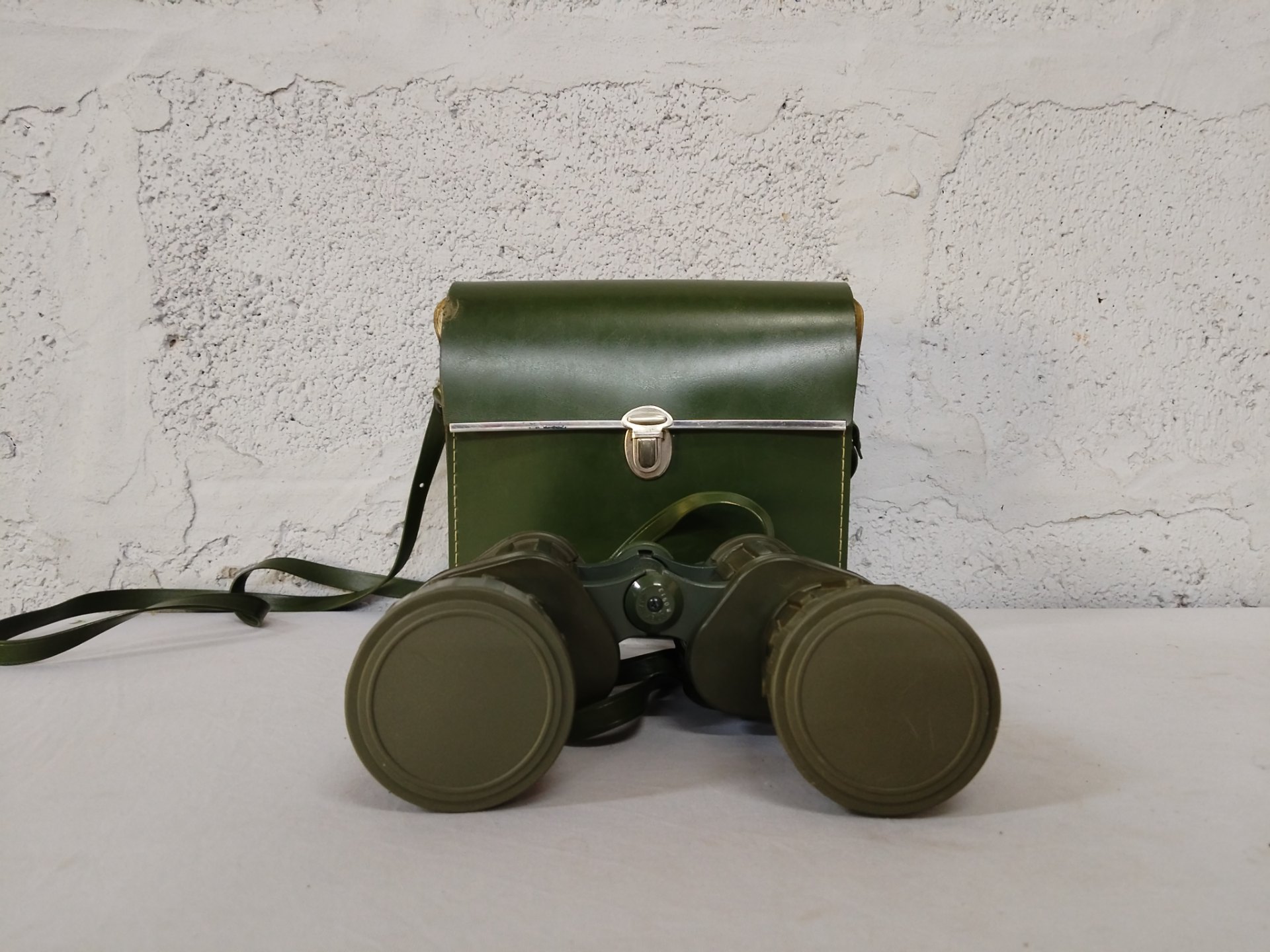 Green military-style binoculars with shoulder case — Japan-marked, lens caps & blue-coated optics