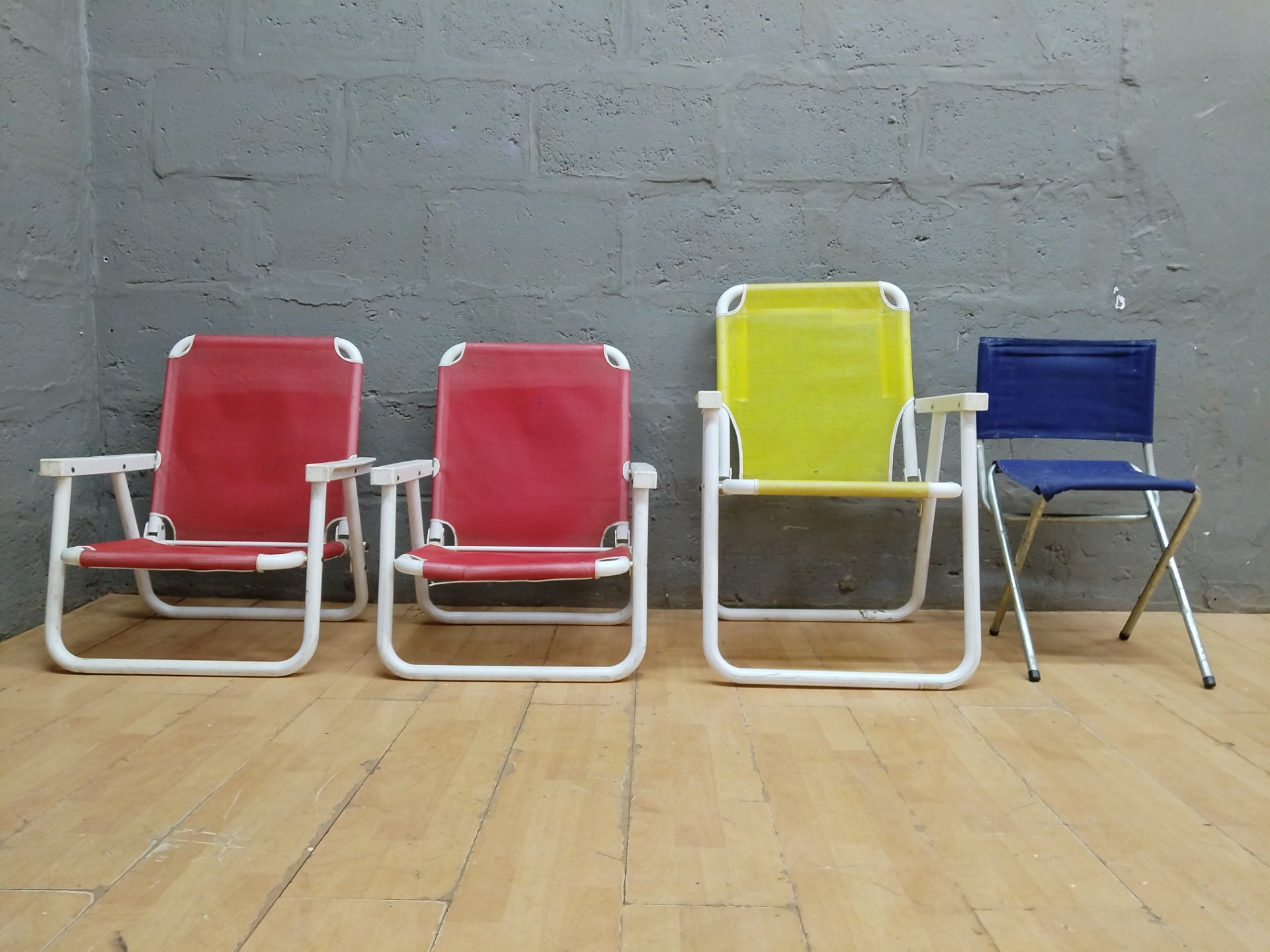 Lot of 4 folding outdoor / beach chairs — mixed colours, used condition, needs cleaning