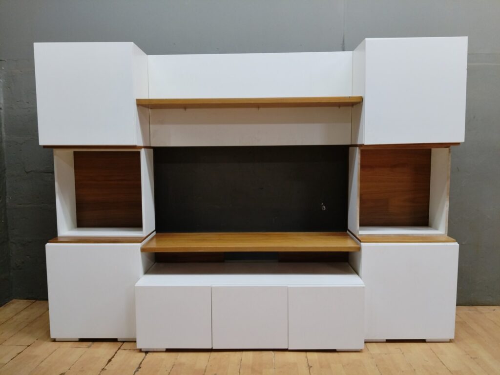 Large modular entertainment / TV wall unit — assembled white cabinets with timber shelves (261 x 40 x 190 cm)