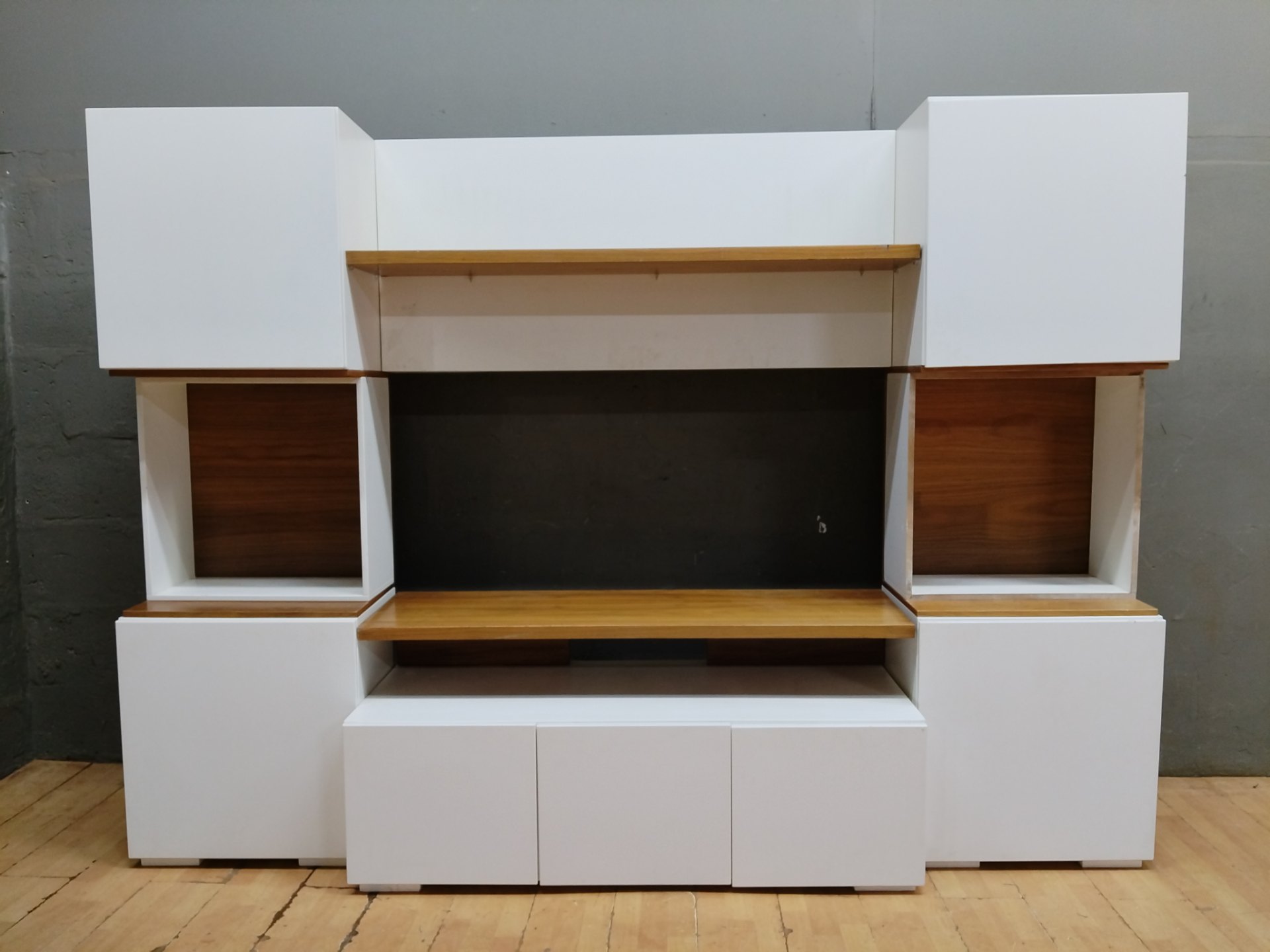 Large modular entertainment / TV wall unit — assembled white cabinets with timber shelves (261 x 40 x 190 cm)