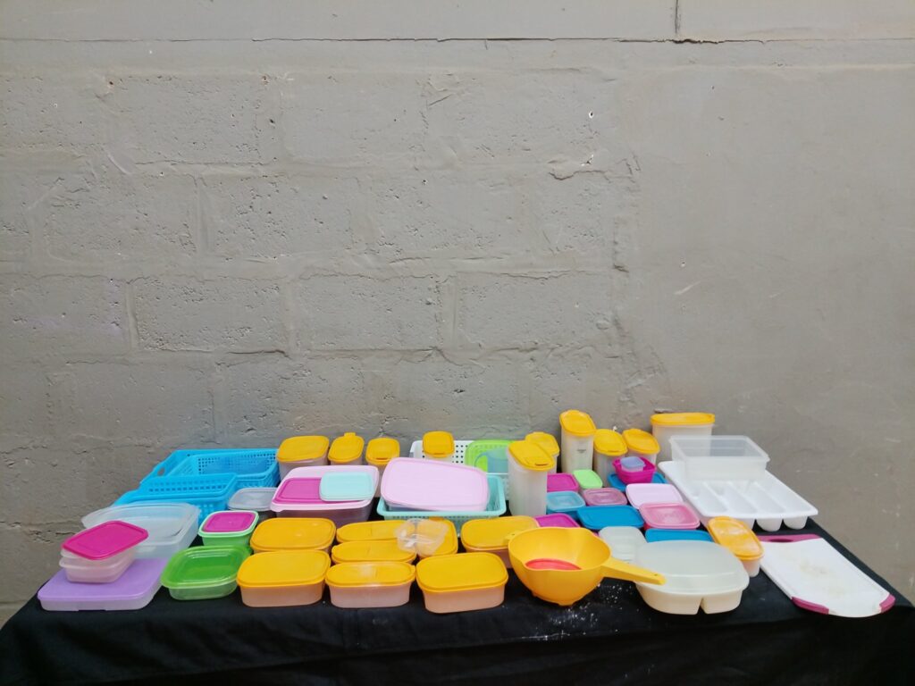 Bulk lot: 36 assorted plastic food storage containers, lids, trays & kitchen accessories (used)