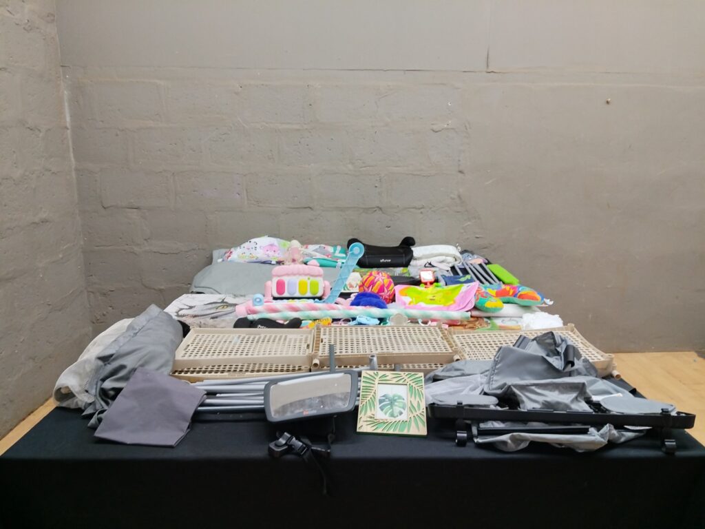 Mixed baby/toddler lot — toys, cushions, BeSafe car mirror, play panels & poles (approx. 40 pcs) — used, not working electronics