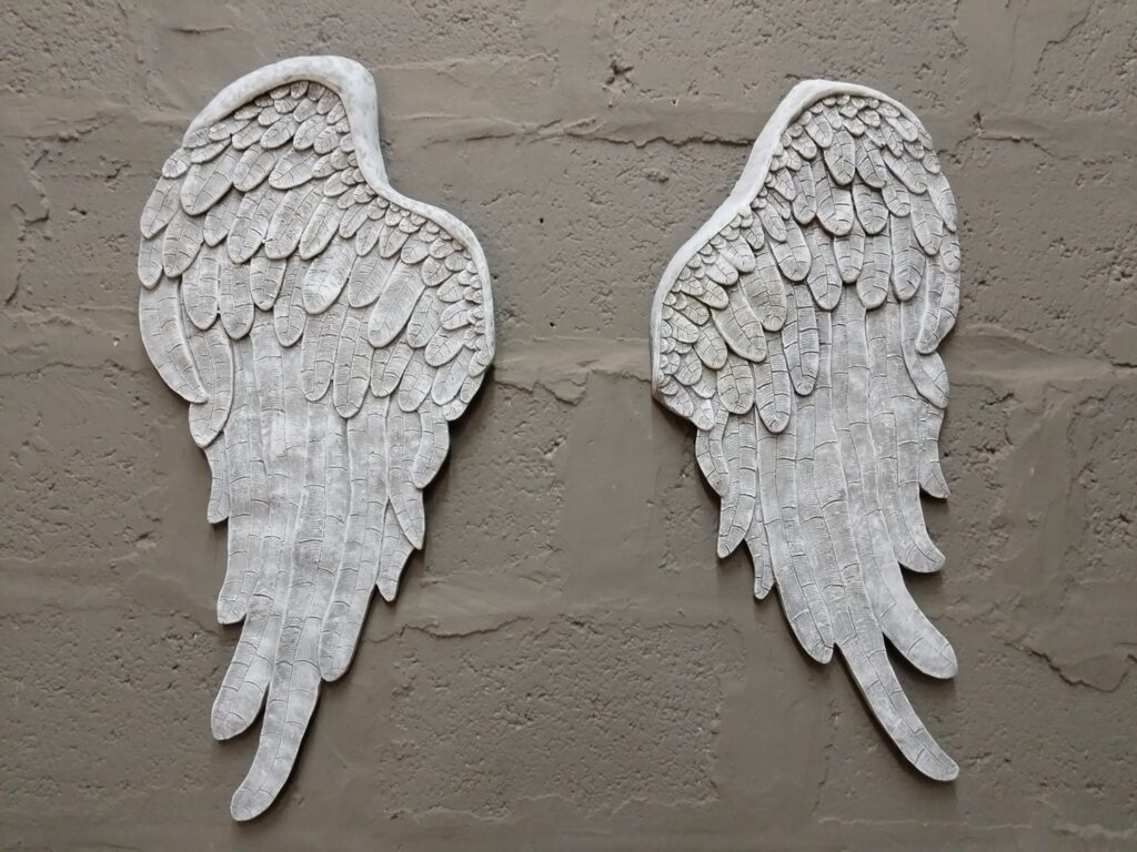Pair of whitewashed angel wing wall plaques — relief feather detail, 83 x 38 x 1 cm (each)