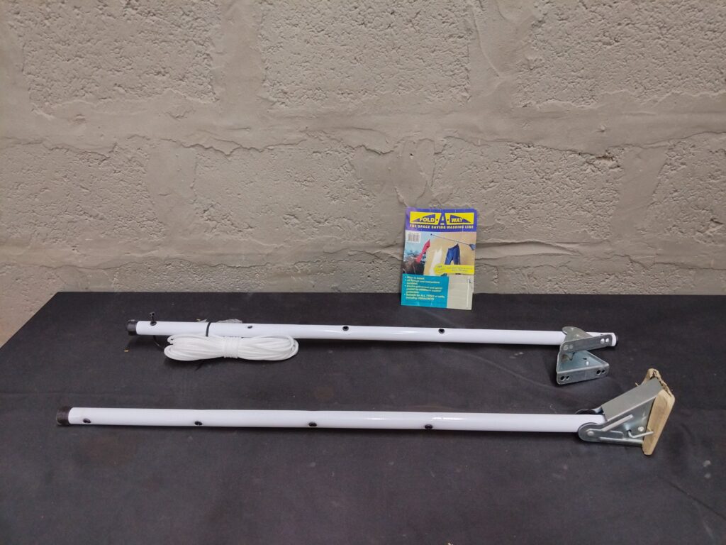 Fold-A-Way / Fold A Line wall-mounted folding clothesline arms with rope, brackets (used)