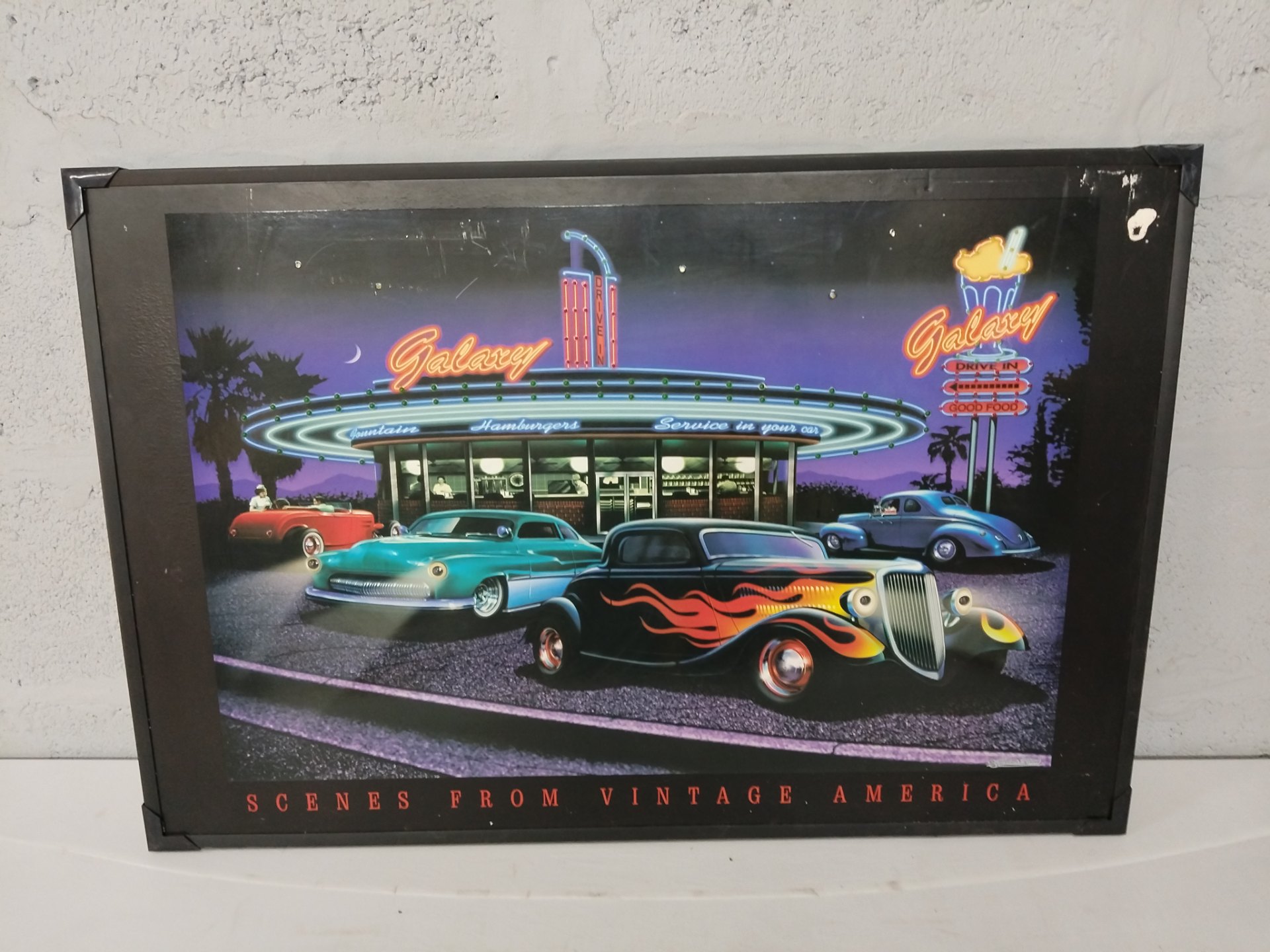 Framed ‘Scenes From Vintage America’ wall print — 62 x 92 cm (external), plastic glazing, worn frame & water-stained back