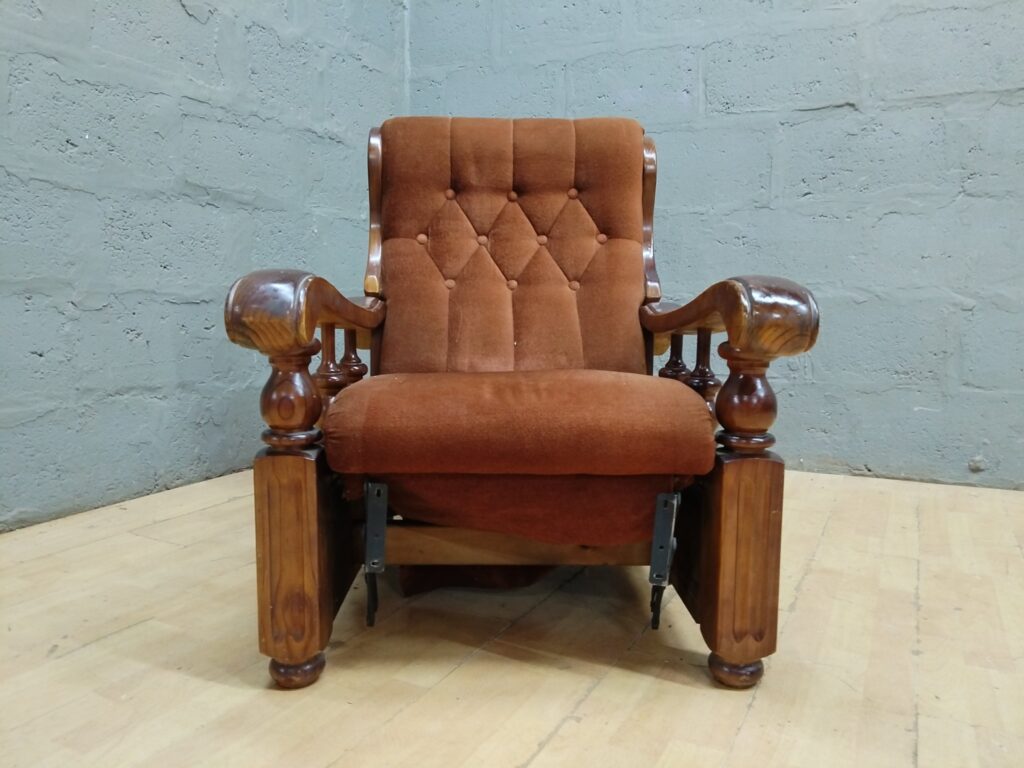 Airelex button-tufted wooden reclining armchair — brown upholstery, reclining mechanism (needs attention)