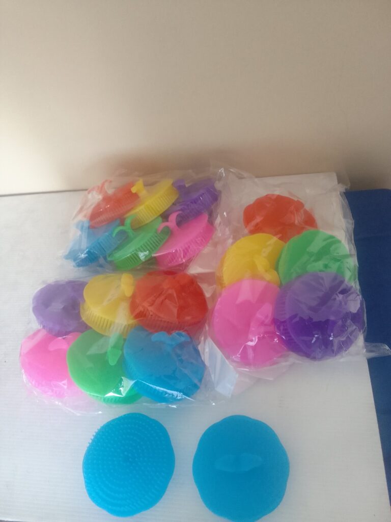 Lot of 36 colourful silicone facial cleansing scrubbers – new & sealed, textured pads