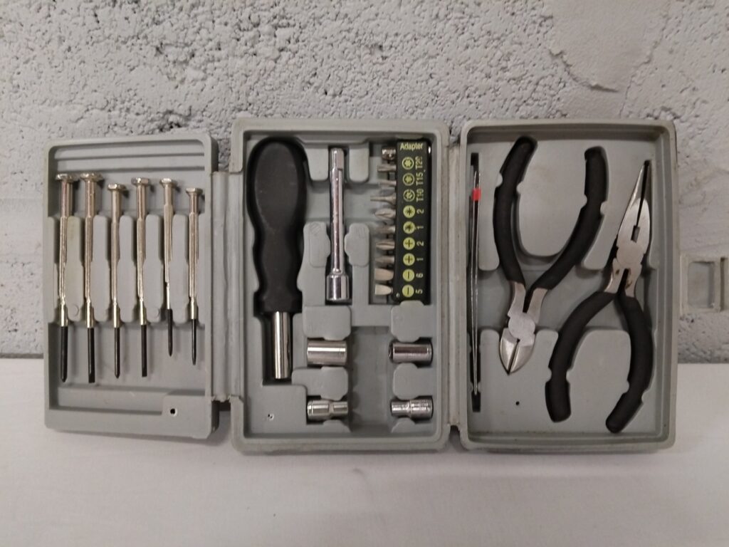 Compact Hand‑Tool Kit — precision screwdrivers, bits, sockets & 3 pliers in grey case (used)