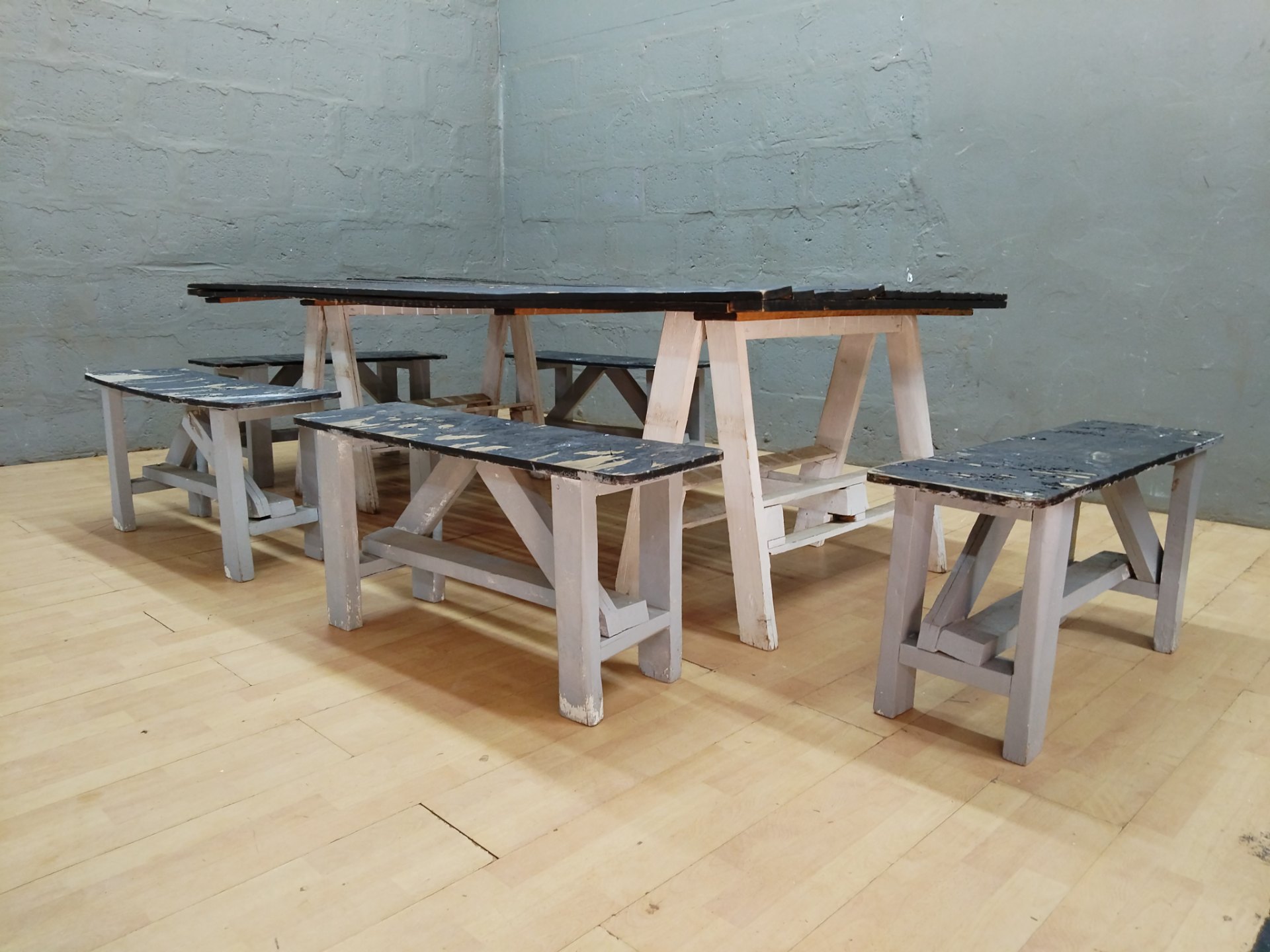 Long wooden picnic-style table + 5 benches — weathered, repair required