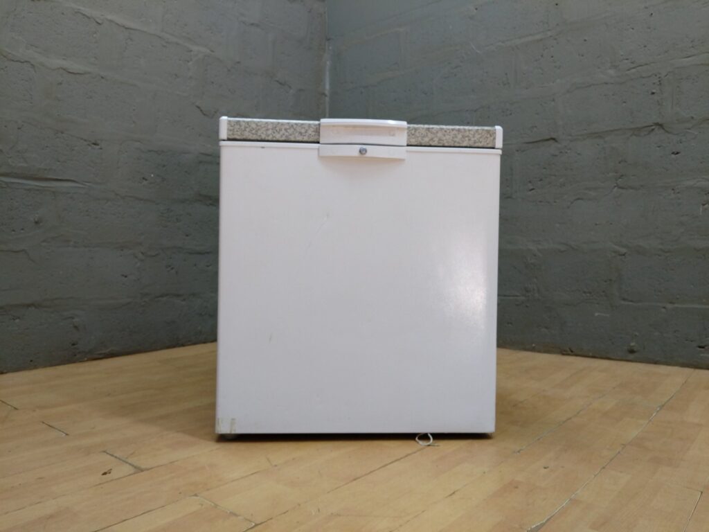 Defy CF210‑HC Chest Freezer — Compact 195 L (labelled), compressor & power cable visible, lock fitted (no key)