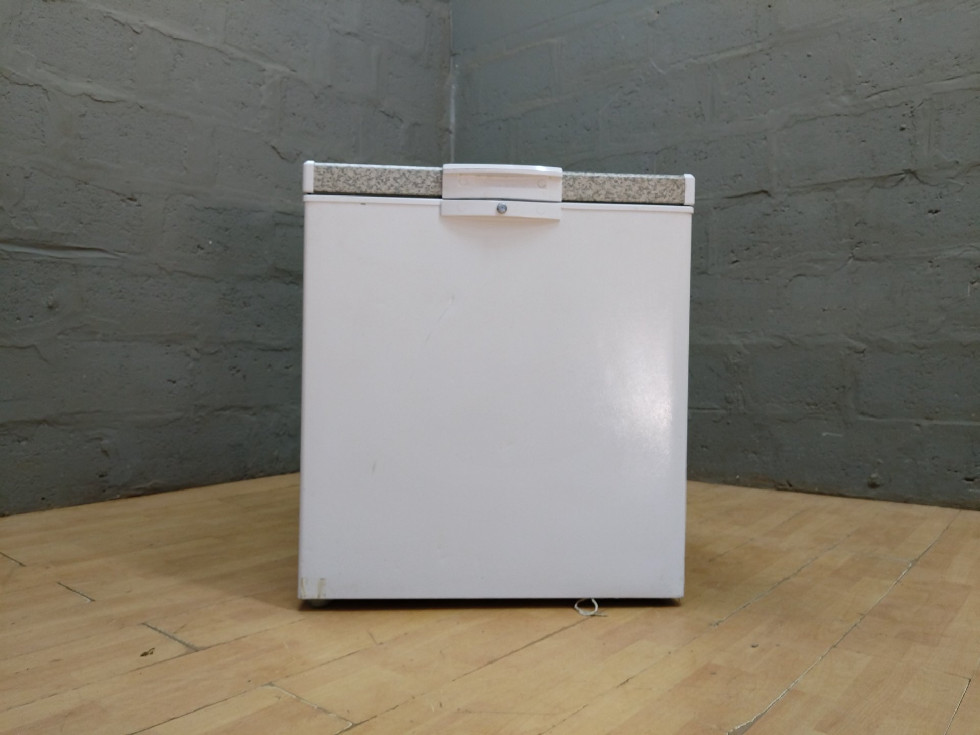 Defy CF210‑HC Chest Freezer — Compact 195 L (labelled), compressor & power cable visible, lock fitted (no key)