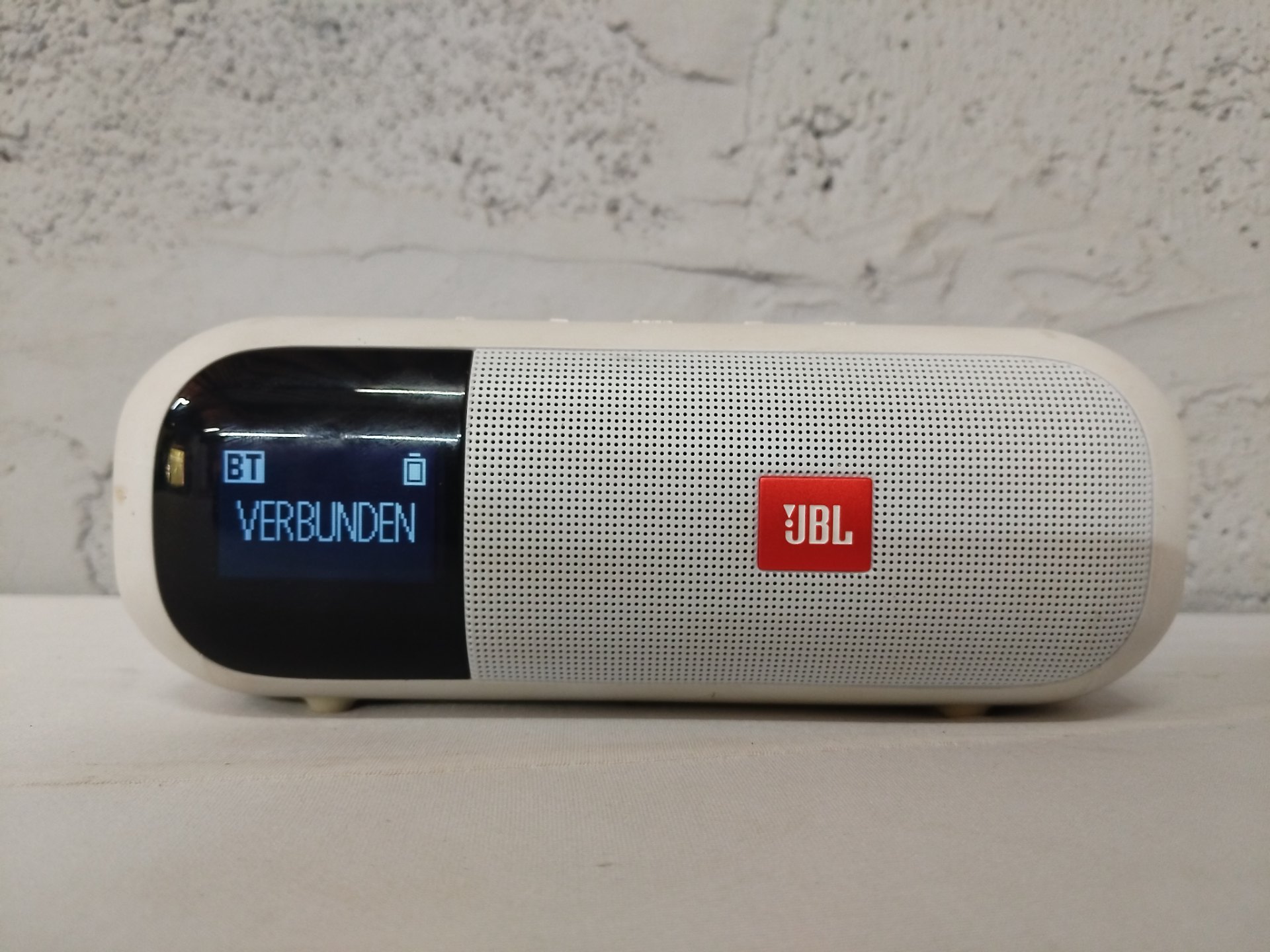 JBL portable Bluetooth speaker (display + retractable antenna) — powers on, audio tested